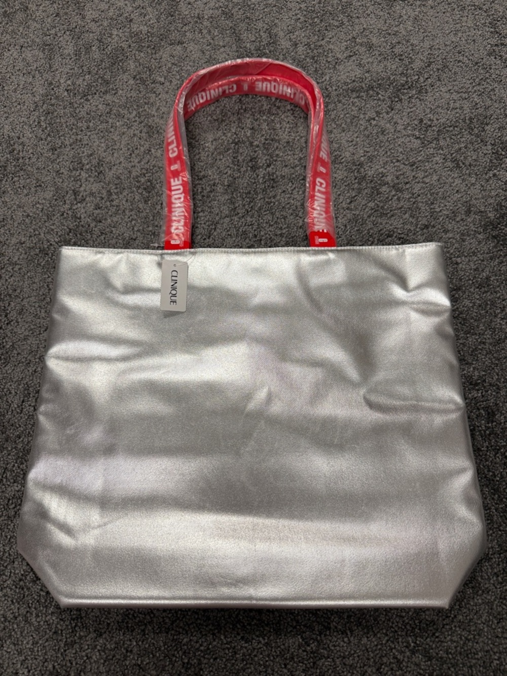 Clinique Silver Tote with Red Logo Handles